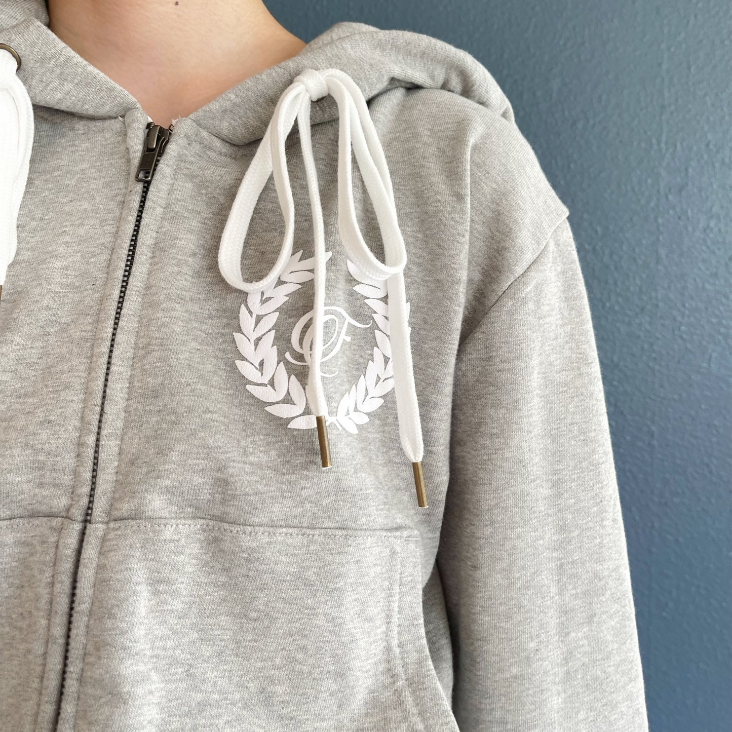 [fa.er.ie] eyelet corset hood zip-up / melange grey / コルセットフードジップアップ
