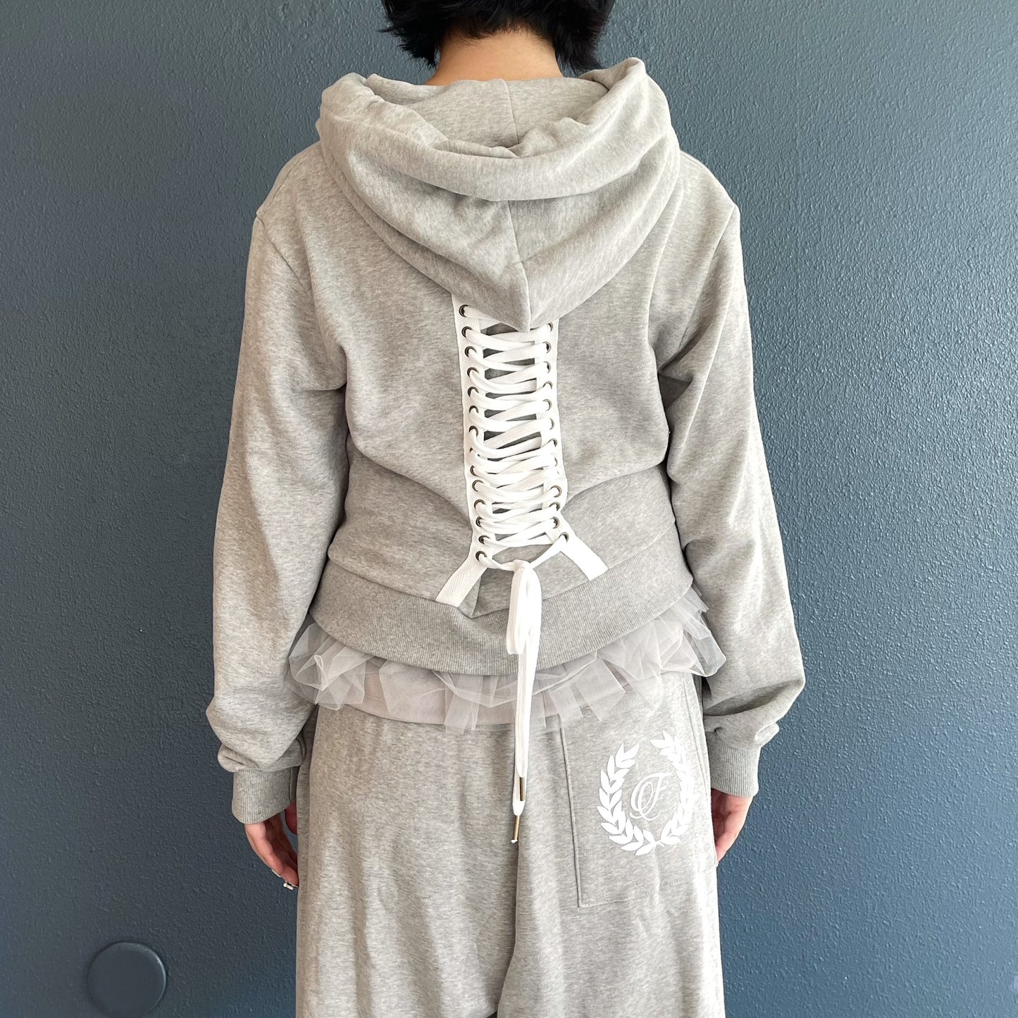 [fa.er.ie] eyelet corset hood zip-up / melange grey / コルセットフードジップアップ