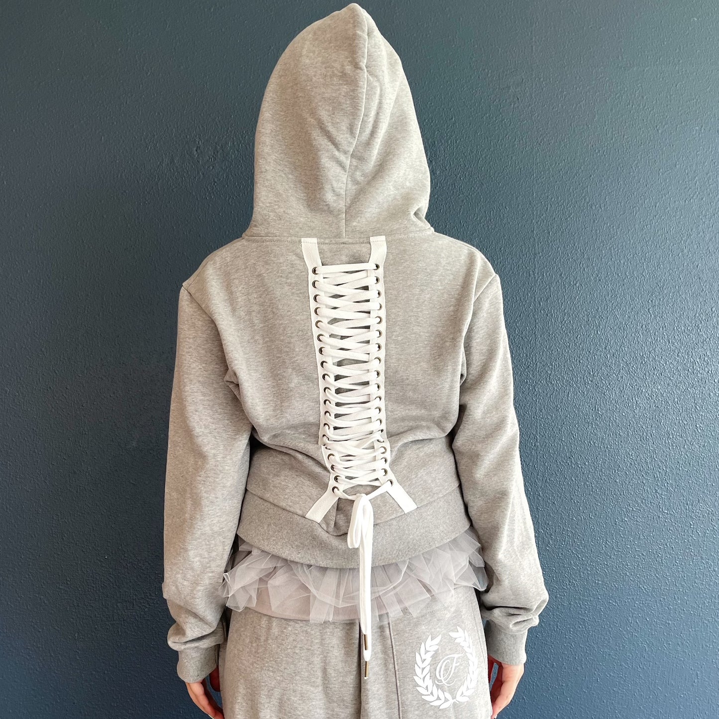 [fa.er.ie] eyelet corset hood zip-up / melange grey / コルセットフードジップアップ