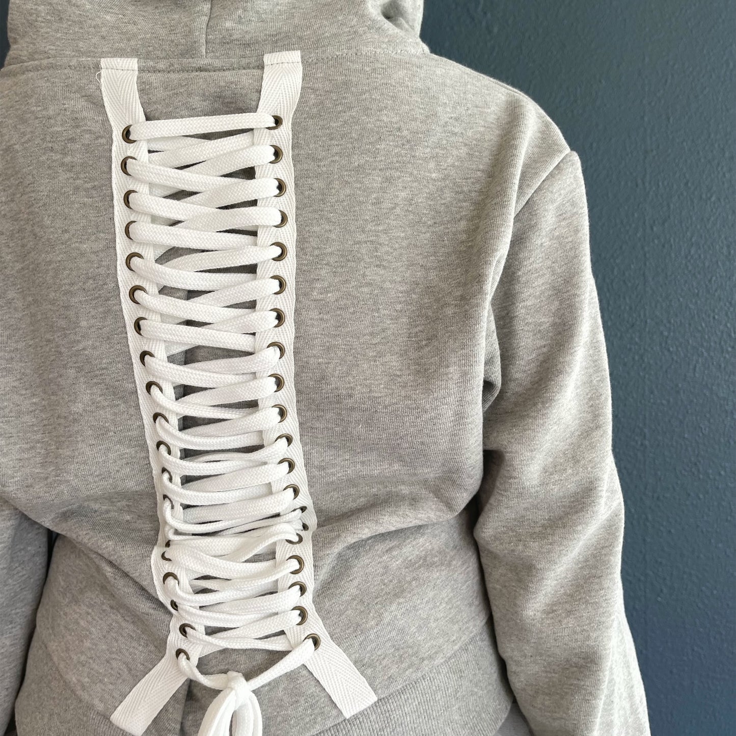 [fa.er.ie] eyelet corset hood zip-up / melange grey / コルセットフードジップアップ