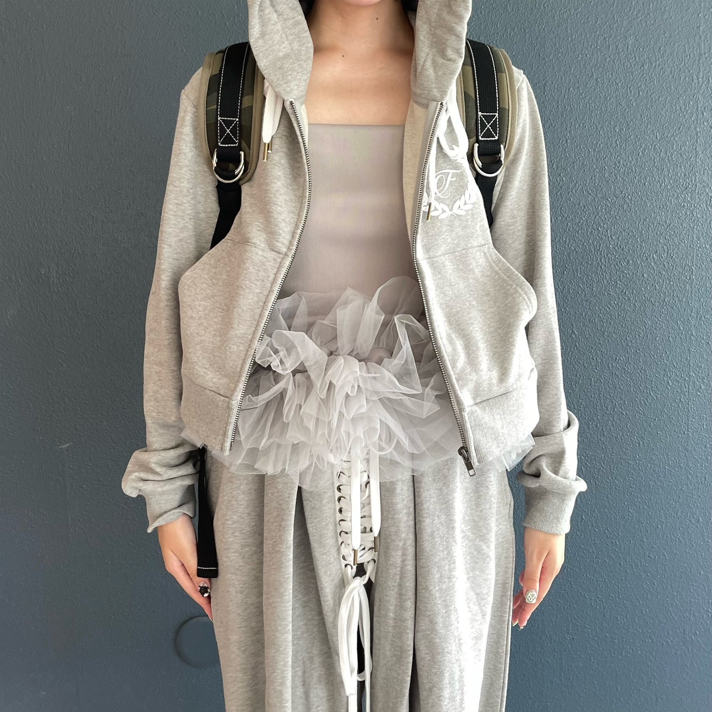 [fa.er.ie] eyelet corset hood zip-up / melange grey / コルセットフードジップアップ