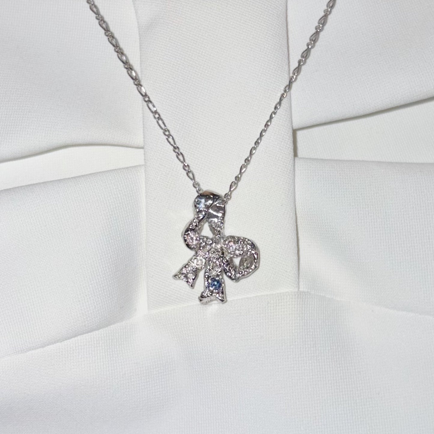 ribbon necklace / zirconia / リボンネックレス